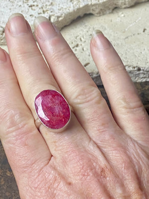 Our large facet cut ruby is set in a simple sterling silver bezel to show off the beauty and size of the stone. This is a statement ring that can be worn be either men or women. Measurements: Ruby 2 x 1.5 cm Size 8.5 | 18.75 mm