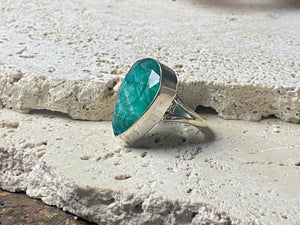 Our large facet cut emerald is set in a simple sterling silver bezel to show off the beauty and size of the stone, which is frankly huge. And it's a beautifully even, deep coloured stone as well. This is a statement ring that can be worn be either men or women. Measurements: Emerald 2.5 x 1.7 cm Size 8.5 | 18.75 mm