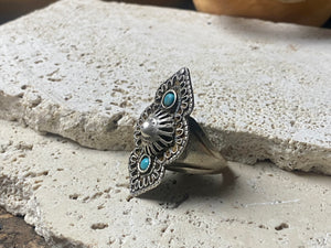 beautiful statement ring made by a Rajasthani village silversmith just outside of Jaipur. Sterling silver and blue ceramic beads with hand wired (not cast) filigree face decoration. Rajasthan, India. Looks great on a man's hand or woman's hand. Measurements: Face 4 cm x 2.5 cm Size 9.25 | 19.25 mm