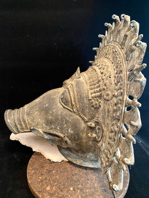 Ceremonial dancer's headpiece worn as a mask in the form of Vishnu's incarnation as Varaha. For ritual use in annual Dharmanema dance festivals. Early 20th century. Bronze lost wax casting. From Kerala, southern India. Measurements: Width 51 cm, height 43 cm, depth 32 cm.