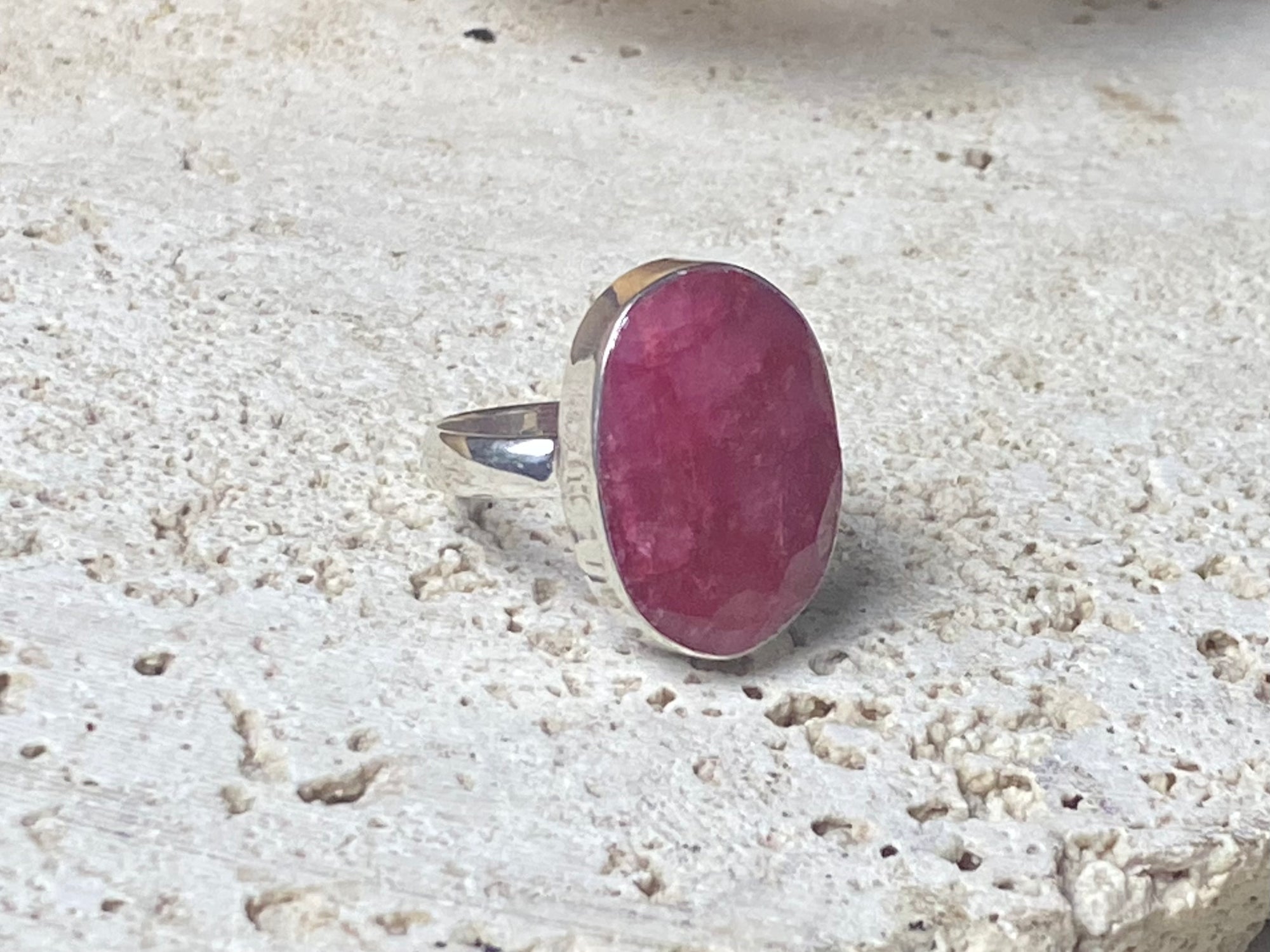  Our large facet cut ruby is set in a simple sterling silver bezel to show off the beauty and size of the stone. This is a statement ring that can be worn be either men or women.  Measurements:  Ruby 2 x 1.5 cm Size 8.5 | 18.75 mm