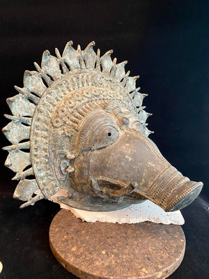 Ceremonial dancer's headpiece worn as a mask in the form of Vishnu's incarnation as Varaha. For ritual use in annual Dharmanema dance festivals. Early 20th century. Bronze lost wax casting. From Kerala, southern India. Measurements: Width 51 cm, height 43 cm, depth 32 cm.