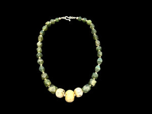 Sea green Afghan serpentine and incised vintage Naga shell beads, finished with sterling silver. Measurements: length 44.5 cm