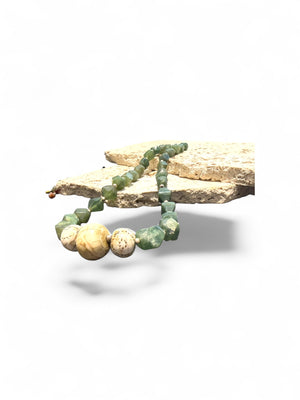 Sea green Afghan serpentine and incised vintage Naga shell beads, finished with sterling silver. Measurements: length 44.5 cm