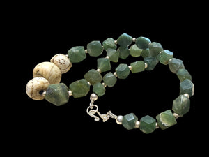 Sea green Afghan serpentine and incised vintage Naga shell beads, finished with sterling silver. Measurements: length 44.5 cm