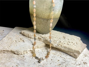 Long necklace made from apricot moonstone with handmade sterling silver Indian beads and centrepiece. A lovely necklace for any occasion. Length: 57.5 cm