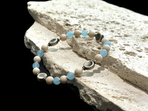 Beaded bracelet of aquamarine, jasper, vintage silver and sterling silver spacer beads. Strung on sturdy elastic cord. Size 18 cm. Beads 6 mm diameter