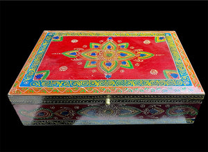 This charmingly painted box features one very large compartment and features a lid that is raised via hinges and. small brass knob as handle. The roominess of the box means it is perfect for holding everything from trinkets to watches, jewellery and keys. A lovely, hand painted piece of craftsmanship from Rajasthan, India.
Measurements: width 38, depth 25 cm, height 10 cm