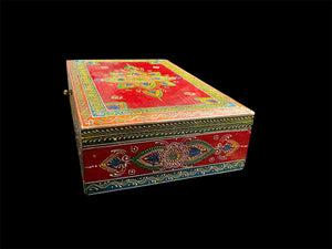 This charmingly painted box features one very large compartment and features a lid that is raised via hinges and. small brass knob as handle. The roominess of the box means it is perfect for holding everything from trinkets to watches, jewellery and keys. A lovely, hand painted piece of craftsmanship from Rajasthan, India.
Measurements: width 38, depth 25 cm, height 10 cm