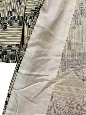 Vintage man or woman's full length Japanese kimono dateing to the 1950s. Silk, hand stitched. Blue black geometric pattern on a cream background.