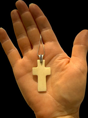 Stylish cross pendant with a southwest vibe. Carved cow bone and sterling silver. This is unisex pendant. Chain/cord not included. Length 5 cm