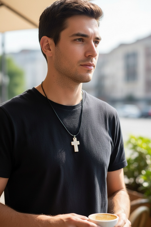 Stylish cross pendant with a southwest vibe. Carved cow bone and sterling silver. This is unisex pendant. Chain/cord not included. Length 5 cm