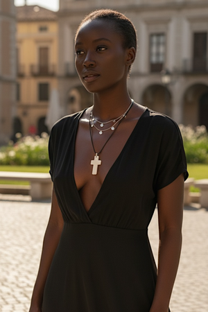Stylish cross pendant with a southwest vibe. Carved cow bone and sterling silver. This is unisex pendant. Chain/cord not included. Length 5 cm