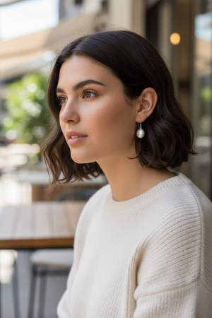 Simple cultured coin pearl earrings finished with sterling silver hooks. Pearl diameter 1.2 mm, earring length 2.8 cm