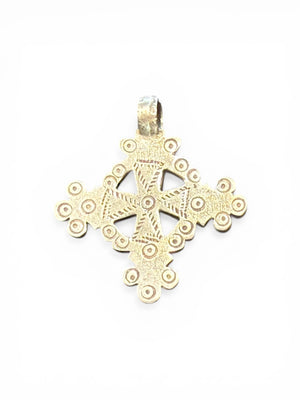 Mid 20th century round Ethiopian silver crucifix, cut from a Marie Therese silver thaler. Almost identical markings on both sides. Small amount of wear at the head of the bail. Height including bail 5.1 cm
