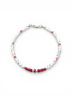 Fine beaded bracelet of facet cut ruby and round rainbow moonstone beads, finished with sterling silver beads and clasp. Length 20.6 cm, size 19 cm