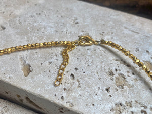 Vibrant gemstones adorn this elegant multi charm necklace. Plated 22k gold over brass, the multicoloured gemstones are evenly spaced and bezel-set to highlight the beauty of each gemstone. This necklace is designed to be worn short, but comes with an extension chain so you can set the length according to your neckline. Measurements: length 41 cm, with extension chain 45.5 cm