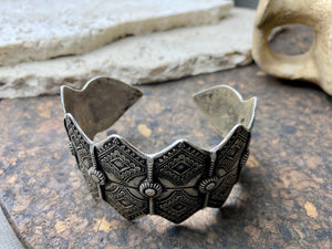 A modern interpretation of an antique style of bracelet, this piece is hand crafted from sterling silver by Rajasthani silversmiths. Exquistely detailed, the oxidised finish shows off the workmanship beautifully. There is some room for movement in this cuff, and it is designed to fit an average sized wrist.  Measurements: Inside opening is 6.5 cm, with room for expansion or contraction