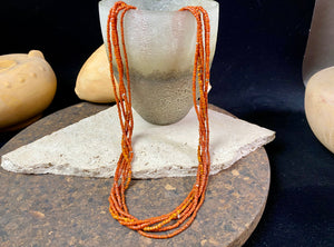 Our long tribal multistrand necklace is made with  antique ceramic beads worn by the Bonda people of the Himalayas. This five strand red-brown-orange necklace is finished with a handmade sterling silver clasp and features sterling silver bead detailing.   Measurements: 66 cm  length
