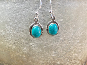 Elegant oval shaped earrings with a beautifully detailed bezel to show off the natural beauty of the cabochon stones. Sterling silver hooks complete the look. Our earrings are open-backed to allow natural light to show through. Length including hook 2.5 cm