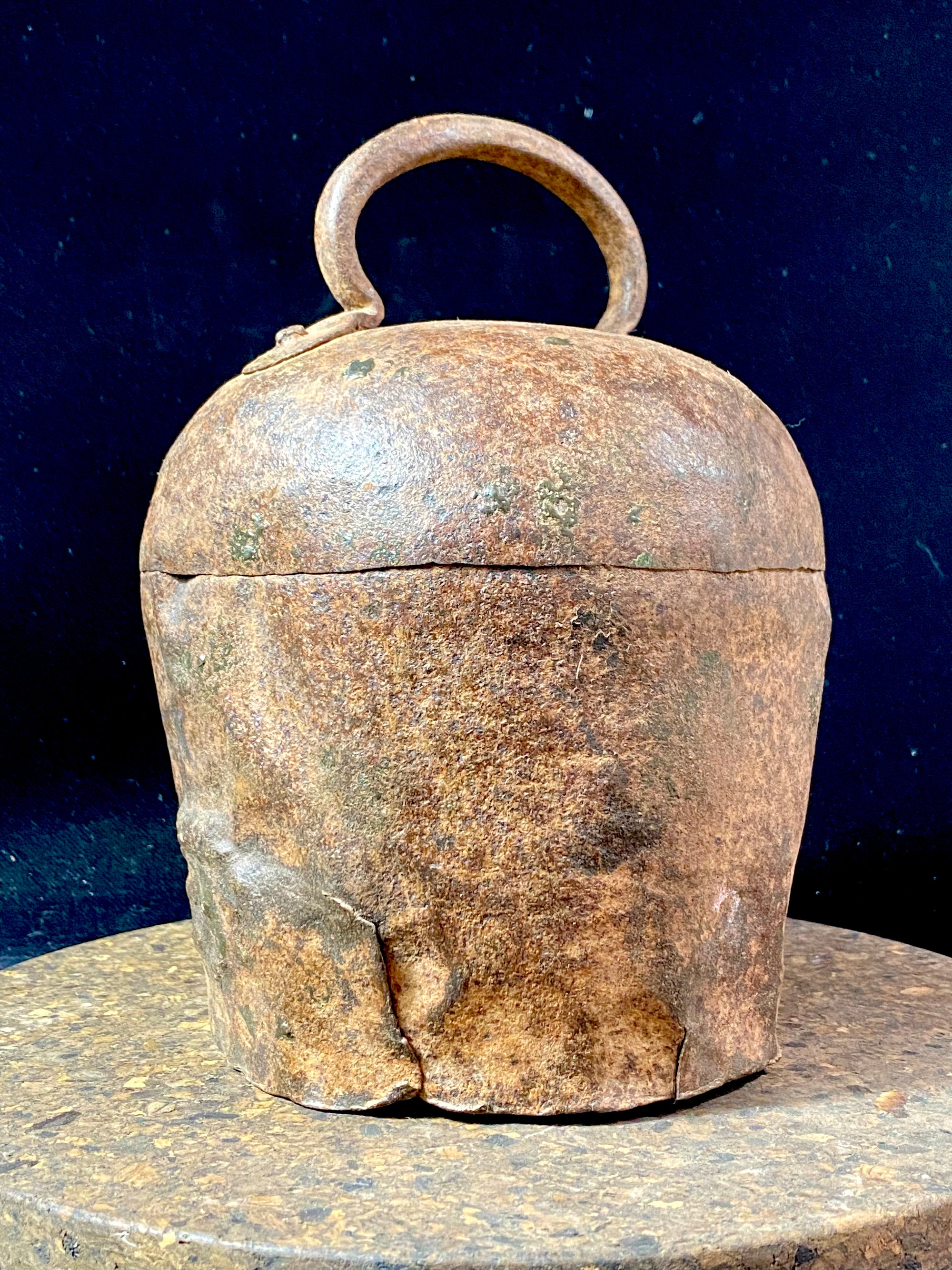 Antique camel or elephant bell, very large, one of the largest we've ever seen. This genuine old piece dates to the early 20th century and has a deep, melodic tone when rung. From Rajasthan, north India. Iron Measurements: Diameter at widest point 16 cm, height including handle 22 cm
