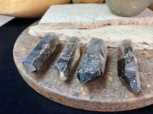 Natural smokey quartz crystal points.  Measurements: our crystals are approximately 8 cm in  length