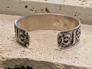 Sterling silver Buddhist Om Manu Padme Hum bracelet. This is a large and substantial men's silver cuff  This beloved Buddhist mantra translates to “hail, jewel in the lotus” and is the prayer of the Compassionate Buddha Avelokitsvara.