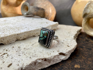 Silver tribal ring, set with a large antique Tibetan turquoise stone. This substantial heavy ring weighs almost 15 grams. Will suit either men or women. Afghanistan. Measurements: Ring face 2.2 x 2 cmInner diameter 17.5 mm | Size 7, however this is an adjustable ring that will fit any finger from size 6 to 8.
