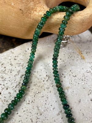 A classic necklace of graduated, matched natural emeralds featuring sterling silver findings and hook clasp. 70 carats of emeralds, length 45.5, bead size 2 mm - 6 mm