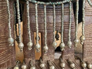 Kambatta wood headrest, Ethiopia. Early 1900's. Heavily carved and beaded. Dark patina and smooth wear on this piece are appropriate to its age. Measurements: height 16 cm (7"), width 18 cm