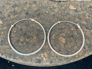 Hand made sterling silver flat hoop earrings with silver wire detailing. If you're looking for a pair of hoops that are elegant and a little different, you're going to love these.  Measurements: outside diameter of hoop approximately 5 cm