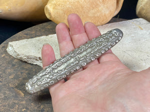 Silver 1.5 Tamlung Lat (short for talat, or currency), often called tiger tongue money, with 3 na (snake) marks. Circa 1591-1707. Laos Vientiane.  This is a hand poured silver ingot with its original patina. Length 11.8 cm