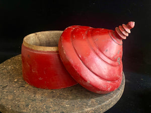 Large red lacquered tikka pot or tikka boxes. Hand carved from single hollowed out pieces of teak, these lidded pots traditionally hold the red vermillion (bindi) powder used for marking the forehead during Hindu ceremonies. They date to the early 1900s. Measurements: approximate diameter 12-14 cm, height 16-18 cm