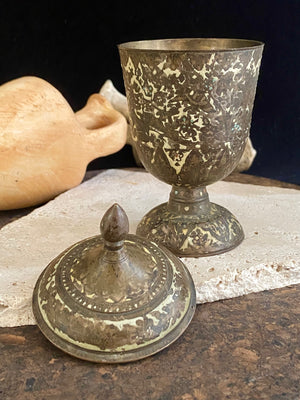 Russian Orthodox church communion chalice. Early 20th century. Engine turned brass with elaborate inlay enamel decoration in white with blue and red highlights. The enamel work is very worn and rubbed in places. Height 15 cm, width 6.5 cm.