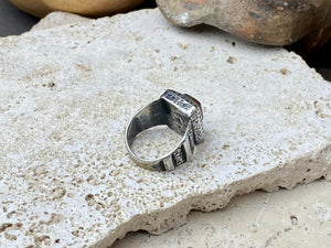 An elegant ring featuring a beautiful dark carnelian stone. The stone shows some wear commensurate with its age. Afghanistan, early to mid 20th century. Can be worn by either men or women. Measurements: Ring face 1.6 x 1.3 cm, inner diameter 18.5 mm | Size 8.5 | No 19