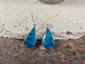 Our stunning earrings feature vibrant, perfectly matched azurite cabochon stones set in sterling silver bezels. Finished with sterling silver hooks. 4.3 x 1.3 cm
