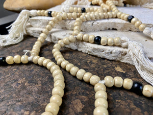 Women or men’s mala necklace. Made from lightweight wood, 108 beads and tasseled spacers. This is a light summer necklace that can be worn or simply hung as decoration. Total length 72 cm. Fits easily over the head. Wood beads 6 mm diameter