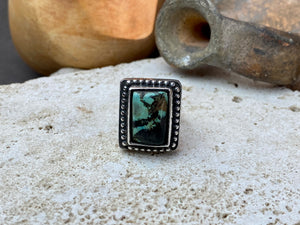 Silver tribal ring, set with a large antique Tibetan turquoise stone. This substantial heavy ring weighs almost 15 grams. Will suit either men or women. Afghanistan. Measurements: Ring face 2.2 x 2 cmInner diameter 17.5 mm | Size 7, however this is an adjustable ring that will fit any finger from size 6 to 8.
