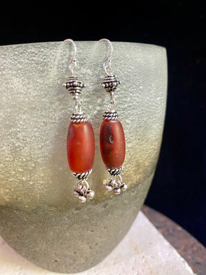 Beautiful long drop earrings combine antique carnelian stones with handmade Indian silver beads and sterling silver hooks. Carnelian stones from Nepal, 5.8 cm length