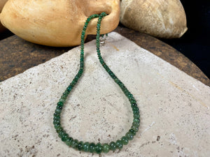 A classic necklace of graduated, matched natural emeralds featuring sterling silver findings and hook clasp. 70 carats of emeralds, length 45.5, bead size 2 mm - 6 mm