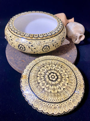 A beautiful low oval lidded bowl or box, traditionally called an opium pot because of its shape. Crafted from hand shaped panels of camel bone over wood, then hand painted. Hand made in Rajasthan, India. Measurements: diameter 24.5 cm, height 10 cm.