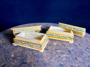 Small perfectly formed trinket or pill boxes, hand crafted from polished hand shaped panels of camel bone, which are then exquisitely hand painted with scenes of elephants. Set on small feet for real elegance. Length  7.5 x 4.5 cm, height 3 cm