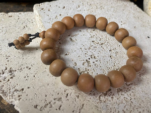 Sandalwood elasticised bracelet. This is a large bracelet and will fit most men's wrists, but also sits well on a women's wrist.  Measurements: Sandalwood beads 10 x 12 mm, inside bracelet circumference 17 cm (6.75 inches).