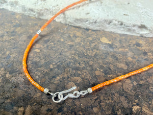 Fine cut beads of bamboo coral, highlighted with traditional handmade sterling silver Rajasthani ball beads. Finished with sterling silver findings and hook clasp. Designed to be unisex, this necklace would look stunning on men and women. Measurements: 41 cm (15.85")