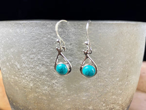 Simply elegant earrings with a difference. Sterling silver hooks complete the look. Our earrings are open-backed to allow the natural light of the cabochon stones to show through. Length including hook 2.7 cm