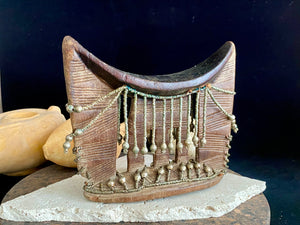 Kambatta wood headrest, Ethiopia. Early 1900's. Heavily carved and beaded. Dark patina and smooth wear on this piece are appropriate to its age. Measurements: height 16 cm (7"), width 18 cm