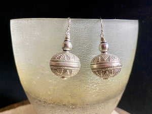 Get the look without the weight. Lightweight and easy to wear, these earrings are crafted from hollow-construction handmade vintage sterling silver beads and components.  Mid 20th century beads collected by Bernard Heaphy from northwest India.  Measurements: length 4 cm