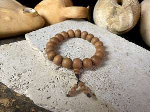 Sandalwood elasticised bracelet. This is a large bracelet and will fit most men's wrists, but also sits well on a women's wrist.  Measurements: Sandalwood beads 10 x 12 mm, inside bracelet circumference 17 cm (6.75 inches).