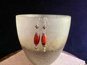 Beautiful long drop earrings combine antique carnelian stones with handmade Indian silver beads and sterling silver hooks. Carnelian stones from Nepal, 5.8 cm length