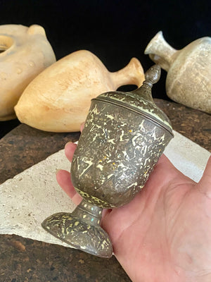 Russian Orthodox church communion chalice. Early 20th century. Engine turned brass with elaborate inlay enamel decoration in white with blue and red highlights. The enamel work is very worn and rubbed in places. Height 15 cm, width 6.5 cm.